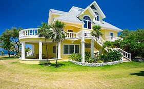 Vila Yellow Bird Sandy Bay Exterior photo